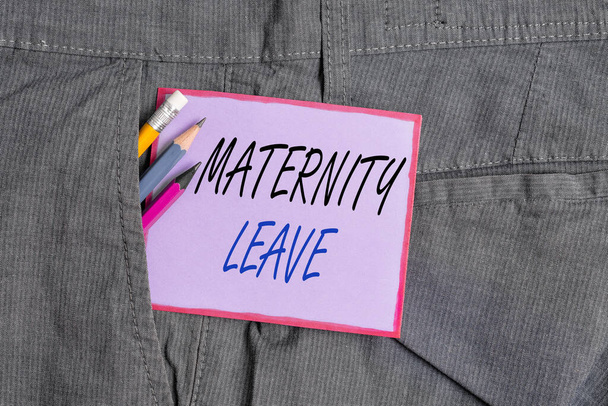 Text sign showing Maternity Leave. Conceptual photo a leave of absence for an expectant or a new mother Writing equipment and purple note paper inside pocket of man work trousers. - Photo, Image