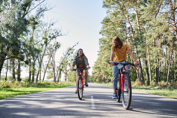 Couple having walk with bike - Fotografie, Obrázek