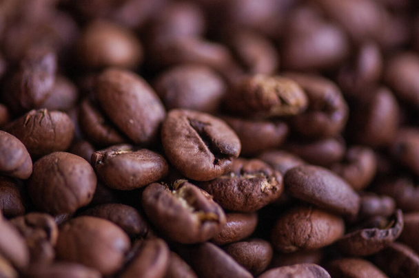Coffee beans background. Light roasted natural coffee beans. Morning and vigor, caffeine. Arabica - Photo, image