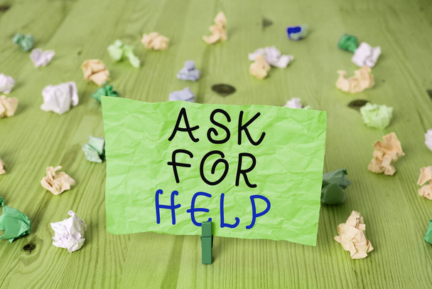 Word writing text Ask For Help. Business concept for put a question or seek an answer or assistance from someone Colored crumpled rectangle shaped reminder paper light blue background. - Photo, Image