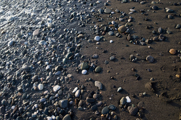 ビー玉の背景、海の岩の質感 - 写真・画像