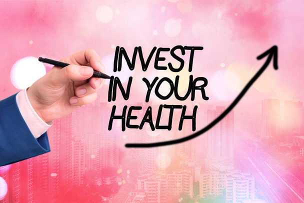 Conceptual hand writing showing Invest In Your Health. Business photo text put money on maintenance or improvement of your health Digital arrowhead curve denoting growth development concept. - Photo, Image