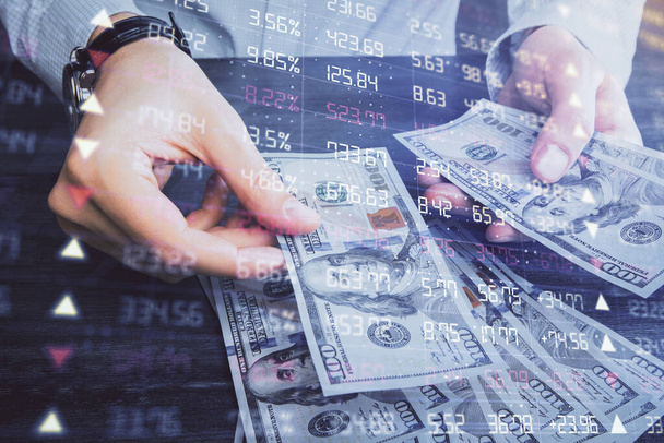 Multi exposure of financial graph drawing hologram and USA dollars bills and man hands. Analysis concept. - Fotoğraf, Görsel