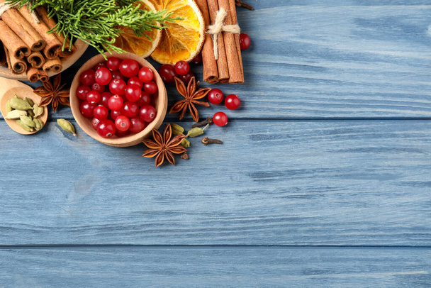 Flat lay composition with mulled wine ingredients on blue wooden table. Space for text - Photo, image