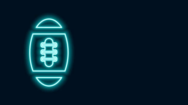 Gloeiende neon lijn American Football bal pictogram geïsoleerd op zwarte achtergrond. Rugby bal icoon. Team sport spel symbool. 4K Video motion grafische animatie - Video