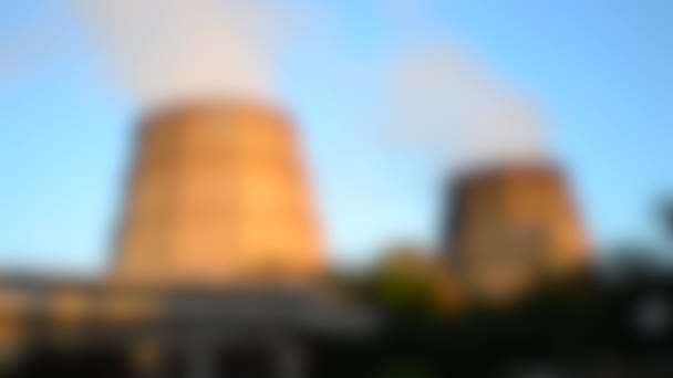 Blurred background. Two pipe thermal power plant in sunset light dawn - Footage, Video
