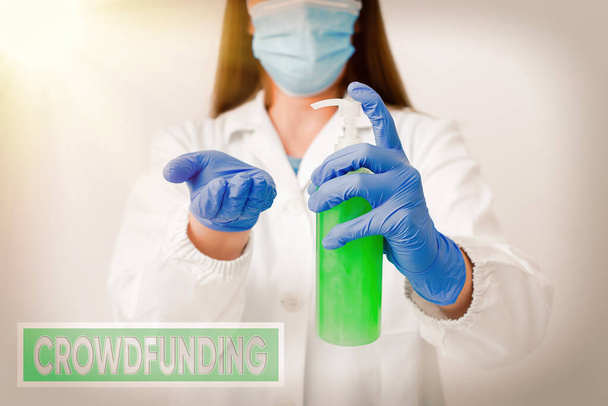 Handwriting text Crowdfunding. Concept meaning practice obtaining needed funding by soliciting contributions Laboratory blood test sample shown for medical diagnostic analysis result. - Photo, Image