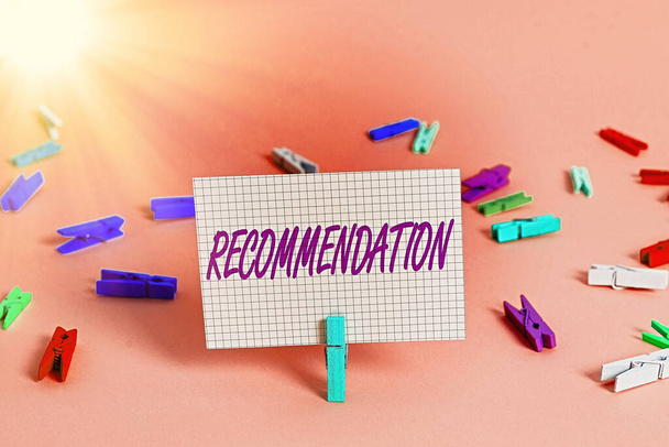 Writing note showing Recommendation. Business photo showcasing something that recommends or expresses commendation Colored crumpled rectangle shaped reminder paper light blue background. - Photo, Image