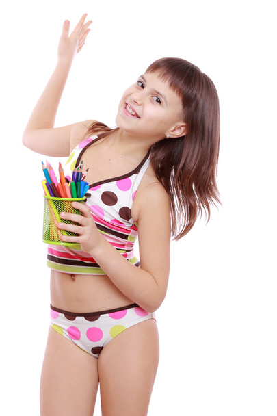 Little girl holding colorful pencils - Fotografie, Obrázek