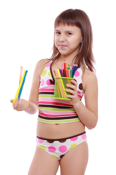 Little girl holding colorful pencils - Fotó, kép