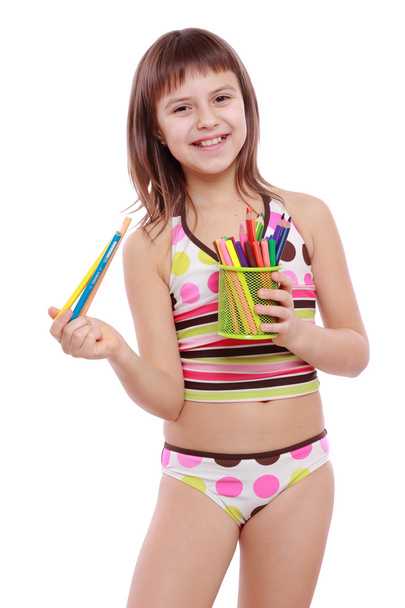 Little girl holding colorful pencils - Foto, Imagem