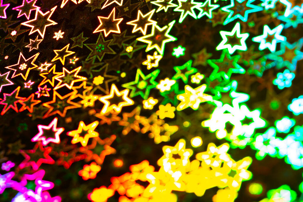 Blured rainbow holographic stars abstract patterned background - Foto, Imagen
