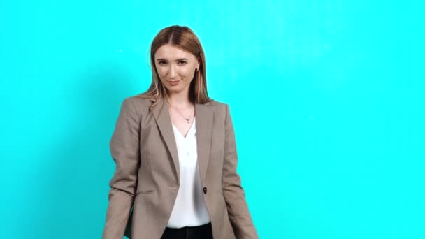 Adult woman, arrogant, stubborn, in business style jacket, imitating horns - Footage, Video