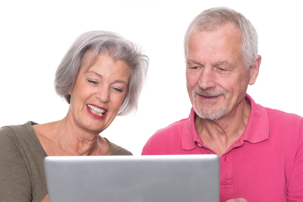 Senior couple with computer - Foto, afbeelding