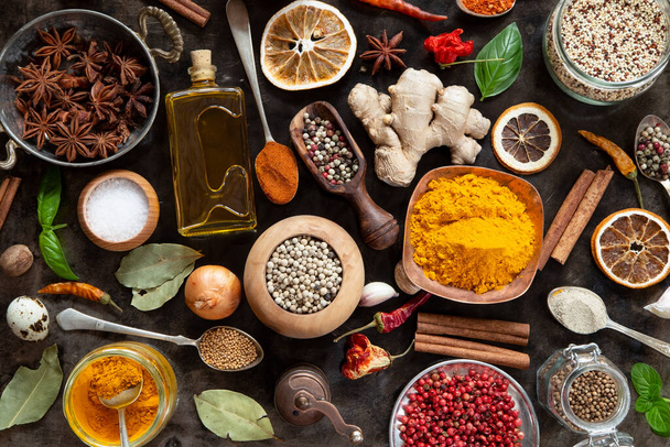 Various herbs and spices on black background - top view - 写真・画像