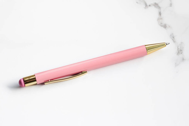 Pink pen on marble background, luxury stationery and business brand - Photo, Image