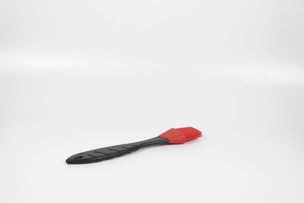 A closeup shot of a culinary brush on white background - Foto, afbeelding