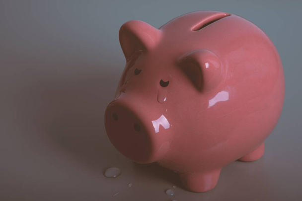 Classic piggy bank cries. Concept of economic difficulty. - Photo, Image