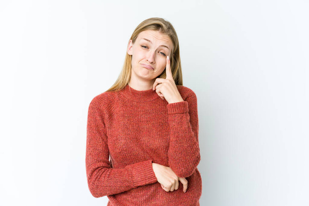 Young blonde woman isolated on white background crying, unhappy with something, agony and confusion concept. - Photo, Image
