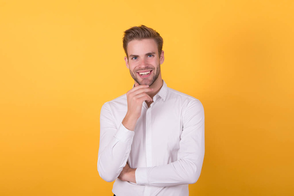 being in good mood. confident businessman in formal wear. office fashion style. male beauty standard. business casual guy. handsome unshaven man wear white shirt. happy macho on orange background - Foto, afbeelding