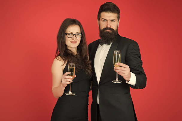 Family celebrate Valentines day. Romantic relationship. Love concept. Celebrating their love. Occasion to celebrate. Couple in love drink sparkling wine. Attractive woman bearded man raise glasses - Фото, изображение