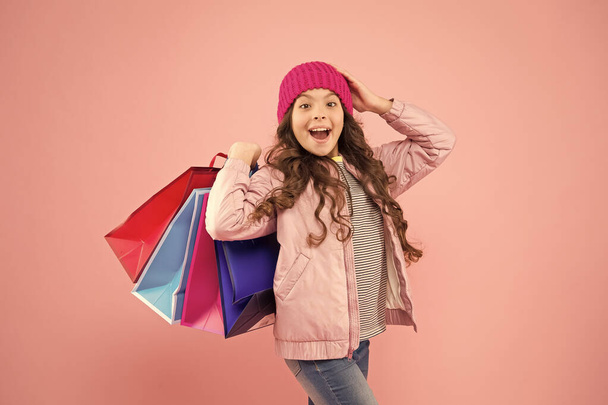 Best deal. Sales and discounts. Home shopping. Small girl with shopping bags. Little girl with gifts. Winter shopping. Buyer consumer concept. Christmas sale. Kid fashion. Holiday purchase saving - Photo, image