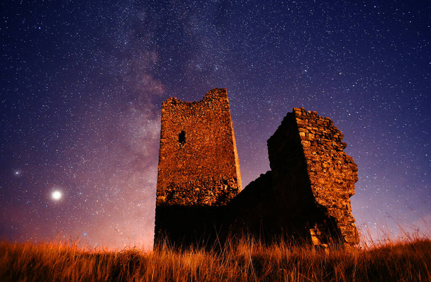 a castle with the milky way in the background - Photo, Image