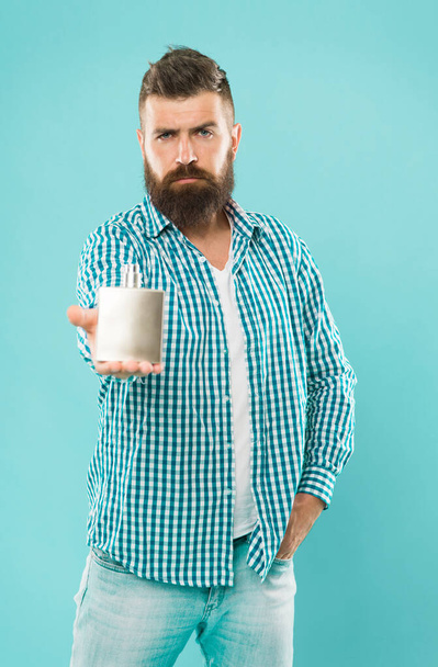 Fragrance for daily life. Man bearded hold bottle perfume. Choose perfume according to occasion. Smell fresh throughout day. Wearing perfume. Benefits of using perfumes. Casual aroma. Brutal hipster - 写真・画像