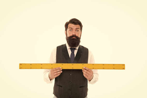 University student taking engineering and science course. In science length may be measured with a metric ruler. shocked about size. bearded man with ruler isolated on white. gauge and measuring - Valokuva, kuva