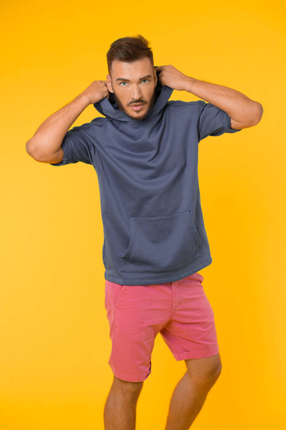 Energetic concept. Energetic man in casual wear on yellow background. Fashion for energetic you. Energetic and active - 写真・画像