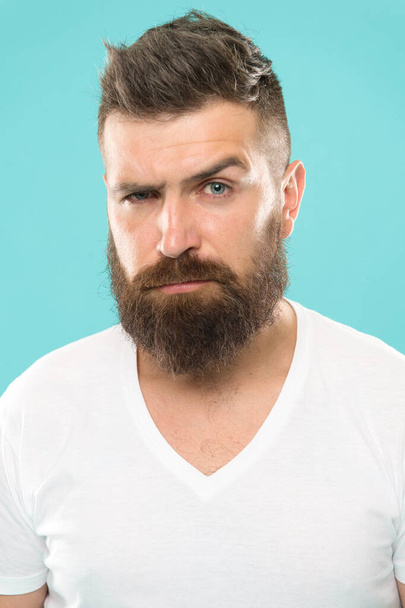 Beard fashion and barber concept. Strict and serious. Man bearded hipster stylish beard turquoise background. Barber tips maintain beard. Stylish beard and mustache care. Hipster appearance - Zdjęcie, obraz