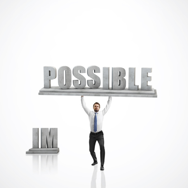 biznesmen podnoszenia słowo "możliwe" - Zdjęcie, obraz