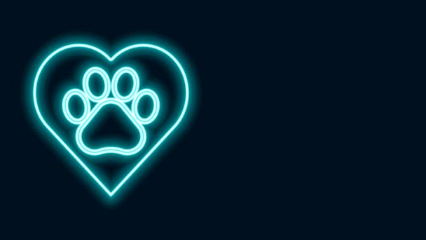 Glowing neon line Heart with animals footprint icon isolated on black background. Pet paw in heart. Love to the animals. 4K Video motion graphic animation - Footage, Video