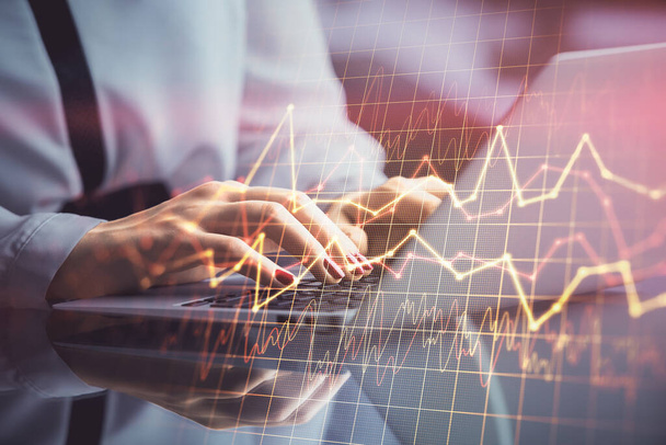 Double exposure of businesswoman hands typing on computer and financial graph hologram drawing. Stock market analysis concept. - Фото, зображення