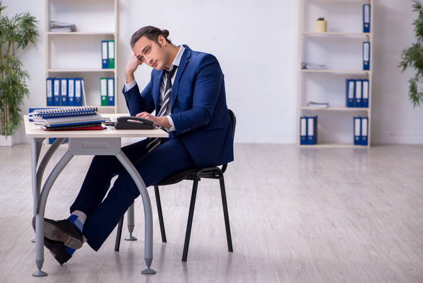 Sick male employee suffering at workplace - Photo, Image