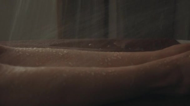 Wet female body unwinding in spa. Bikini woman having water streams massage. - Imágenes, Vídeo