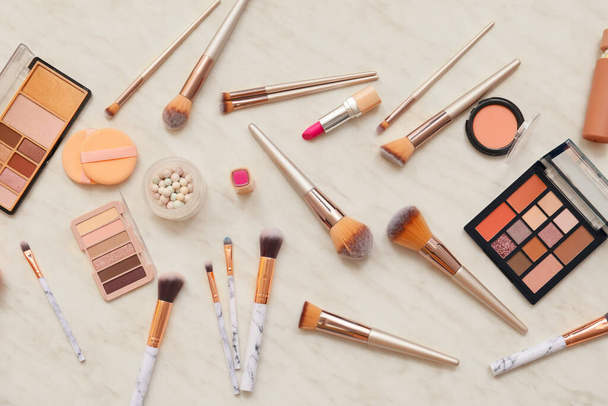 Set of makeup brushes with decorative cosmetics on white background - Photo, Image