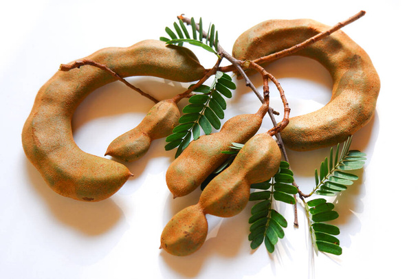 a top view of fresh raw tamarind group isolated on white background - Photo, Image