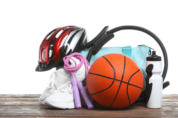 Set of sport equipment on table against white background - Photo, Image