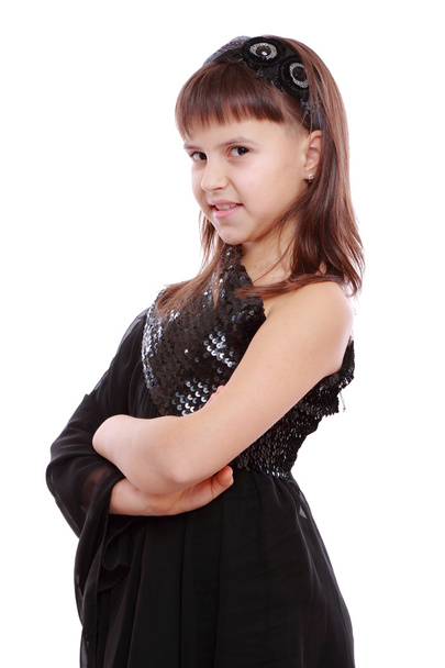 Young girl in a black dress - Фото, изображение