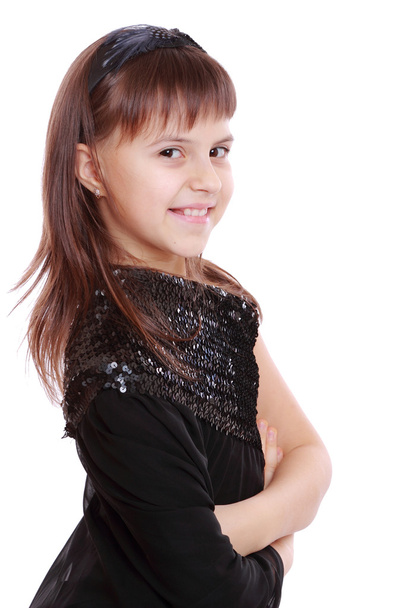 Young girl in a black dress - Foto, afbeelding