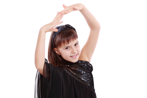 Young girl in a black dress - Фото, зображення