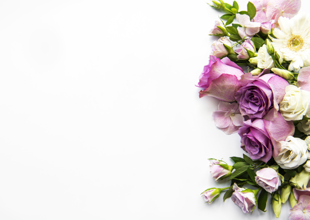 Framework from flowers on white background. Flat lay. - Foto, afbeelding