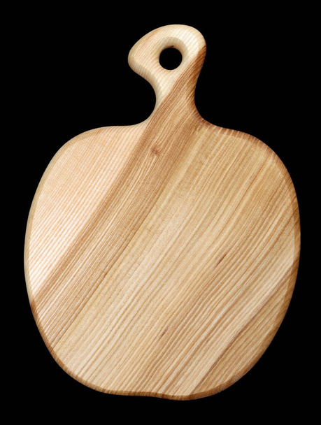 Drewniana ręcznie robiona płyta kuchenna wyrzeźbiona w kształcie jabłka. Idolowany na czarno - Zdjęcie, obraz