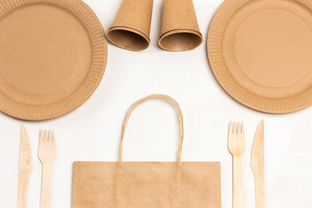Eco-friendly cardboard disposable tableware. White background. Flat lay - Φωτογραφία, εικόνα