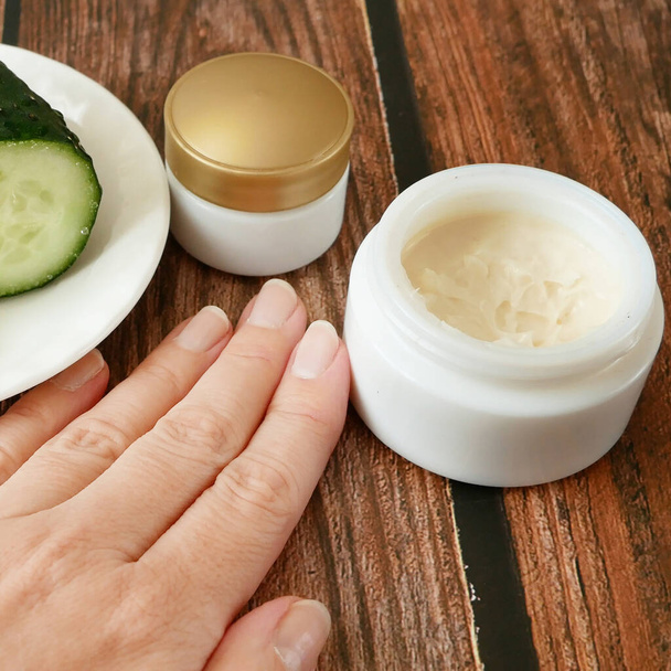 Cucumber cosmetic cream face and hand on silver background, skin and body care hygiene moisture lotion, closeup - Fotoğraf, Görsel