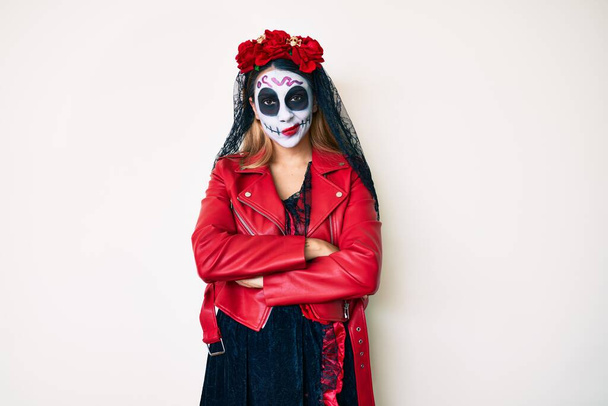 Woman wearing day of the dead costume over white skeptic and nervous, disapproving expression on face with crossed arms. negative person.  - Foto, Bild