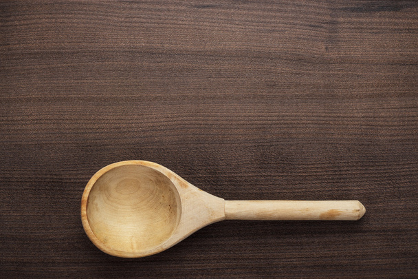 Wooden spoon on the blue table - Foto, Imagem