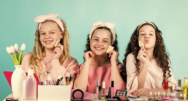 Sweet look. smiling girls friends have fun on spa beauty salon party. beauty portrait of three children with natural make up and healthy skin. happy childrens day. three friends with happy face - Foto, imagen
