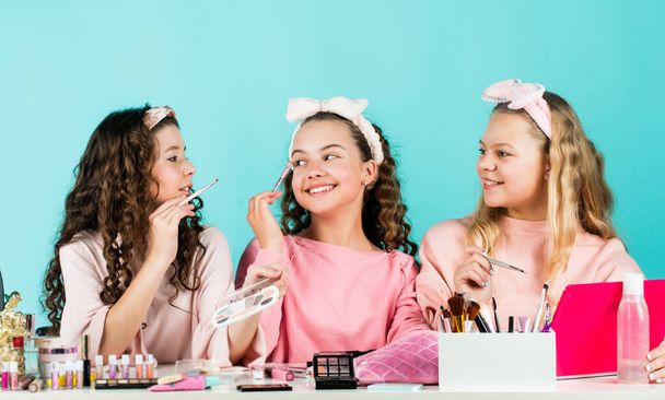 Prevent acne. Kids makeup. Happy girls doing makeup together. Sisterhood happiness. Skin care concept. Cosmetics for children. Beauty and fashion. Cosmetics shop. Apply powder. Cream base tone - Photo, Image